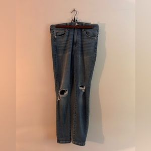 Garage denim, high waisted, stretchy ripped jeans. Size 31.